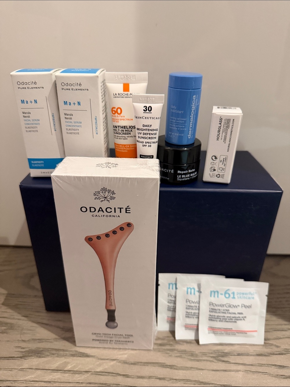 New Odacite Rose-Gold Gua-Sha Facial Tool with two bottles of Marula serum